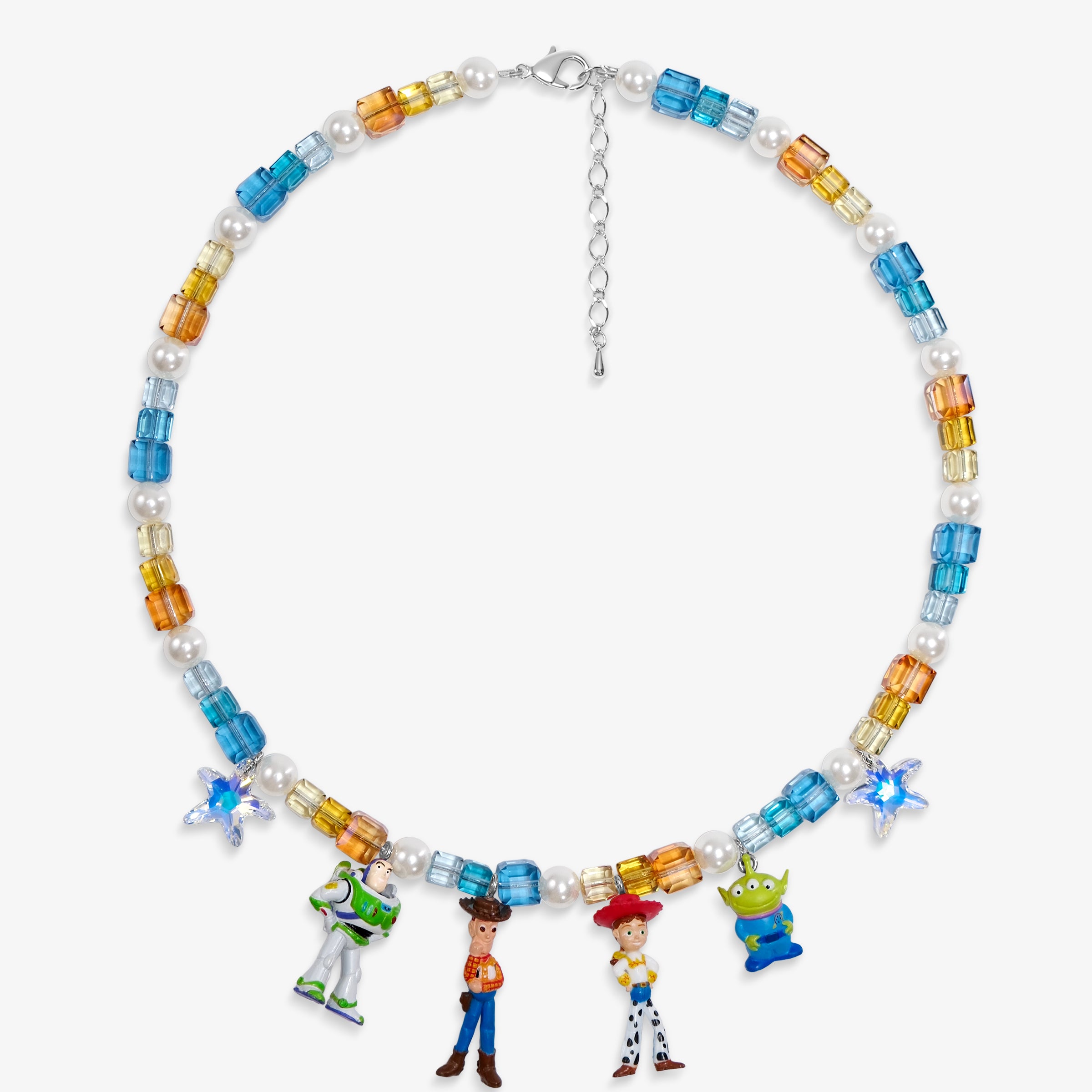 Flat lay of a handmade Swarovski crystal charm necklace with crystals, pearls and rainbow-inspired collectible charm details