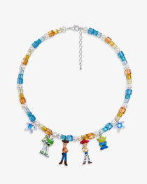 Flat lay of a handmade Swarovski crystal charm necklace with crystals, pearls and rainbow-inspired collectible charm details