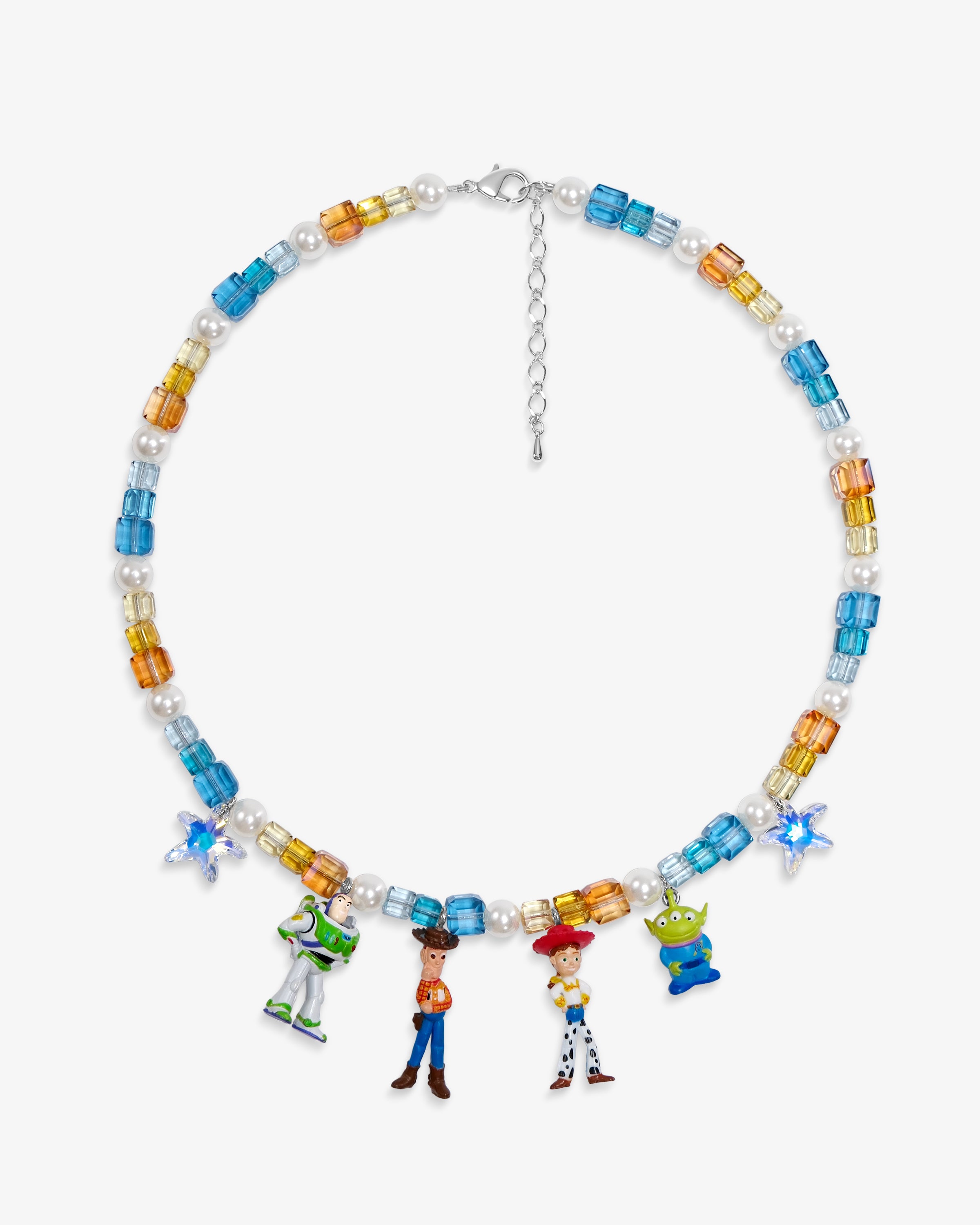 Flat lay of a handmade Swarovski crystal charm necklace with crystals, pearls and rainbow-inspired collectible charm details