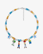 Flat lay of a handmade Swarovski crystal charm necklace with crystals, pearls and rainbow-inspired collectible charm details