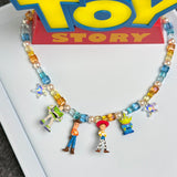 Model wearing a handmade Swarovski crystal charm necklace with crystals, pearls and rainbow-inspired collectible charm details