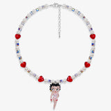 Close-up of a handmade red Swarovski crystal charm necklace with crystals, pearls and retro-inspired collectible charm details