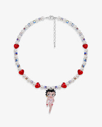 Close-up of a handmade red Swarovski crystal charm necklace with crystals, pearls and retro-inspired collectible charm details