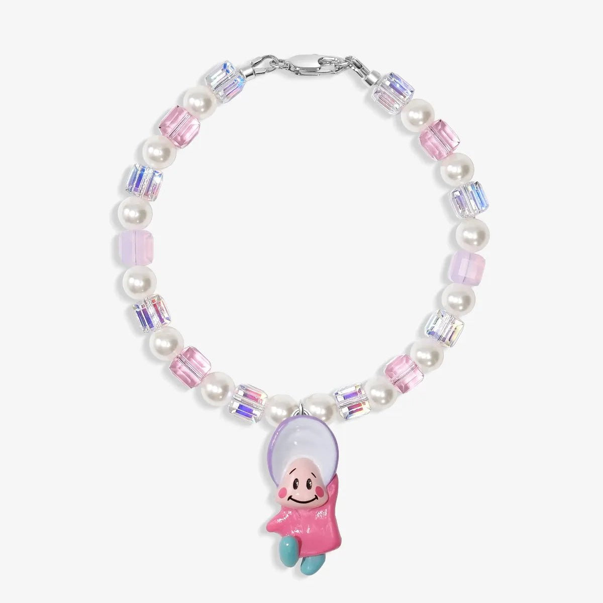 Close-up of a handmade Swarovski crystal charm bracelet with crystals, pearls and nostalgic vintage-inspired collectible charm details