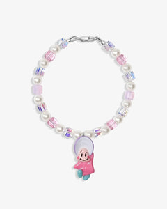 Close-up of a handmade Swarovski crystal charm bracelet with crystals, pearls and nostalgic vintage-inspired collectible charm details