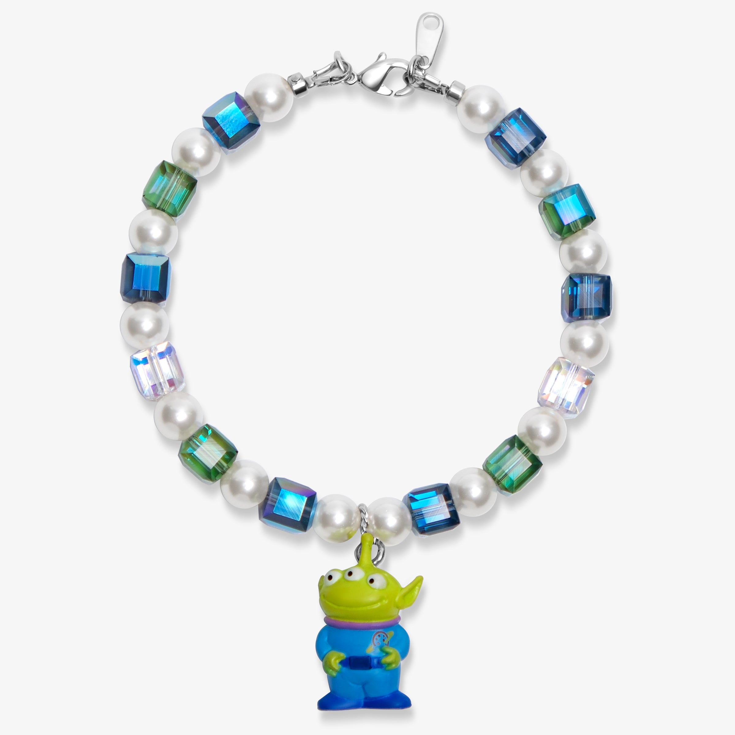 Flat lay of a handmade Swarovski crystal charm bracelet with crystals, pearls and cosmic-inspired collectible charm details