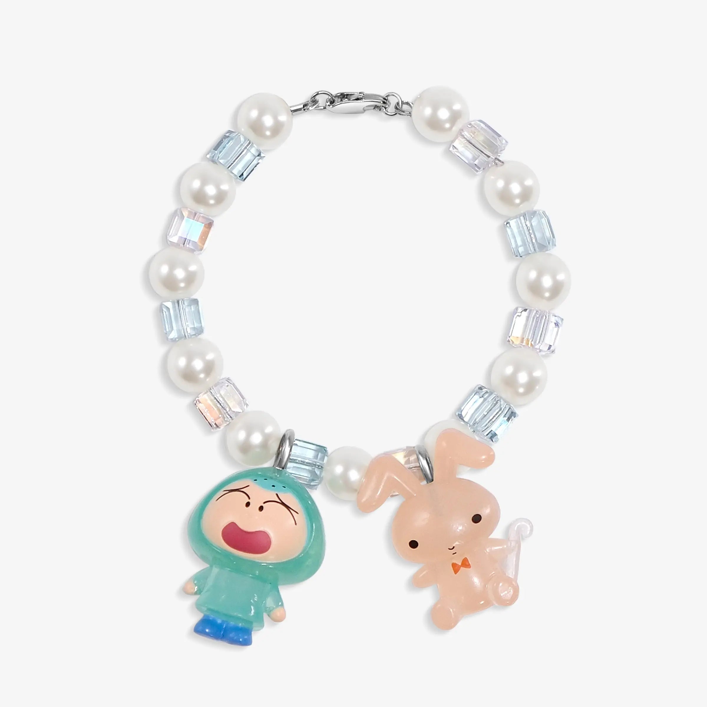 Close-up of a handmade Swarovski crystal charm bracelet with crystals, pearls and retro-inspired collectible charm details