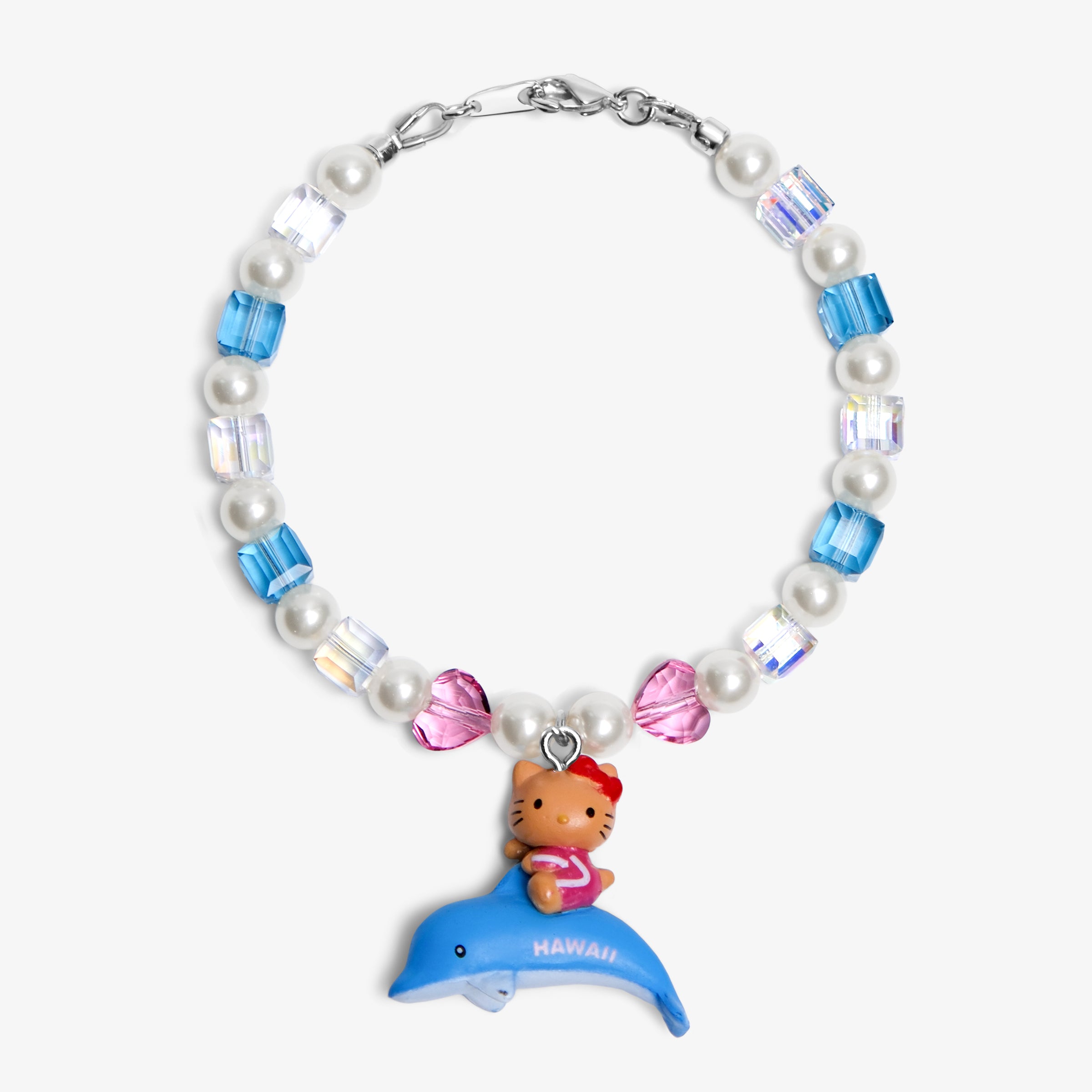 Close-up of a handmade Swarovski crystal charm bracelet with crystals, pearls and surf-inspired collectible charm details