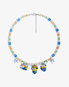 Close-up of a handmade Swarovski crystal charm necklace with crystals, pearls and garden-inspired collectible charm details