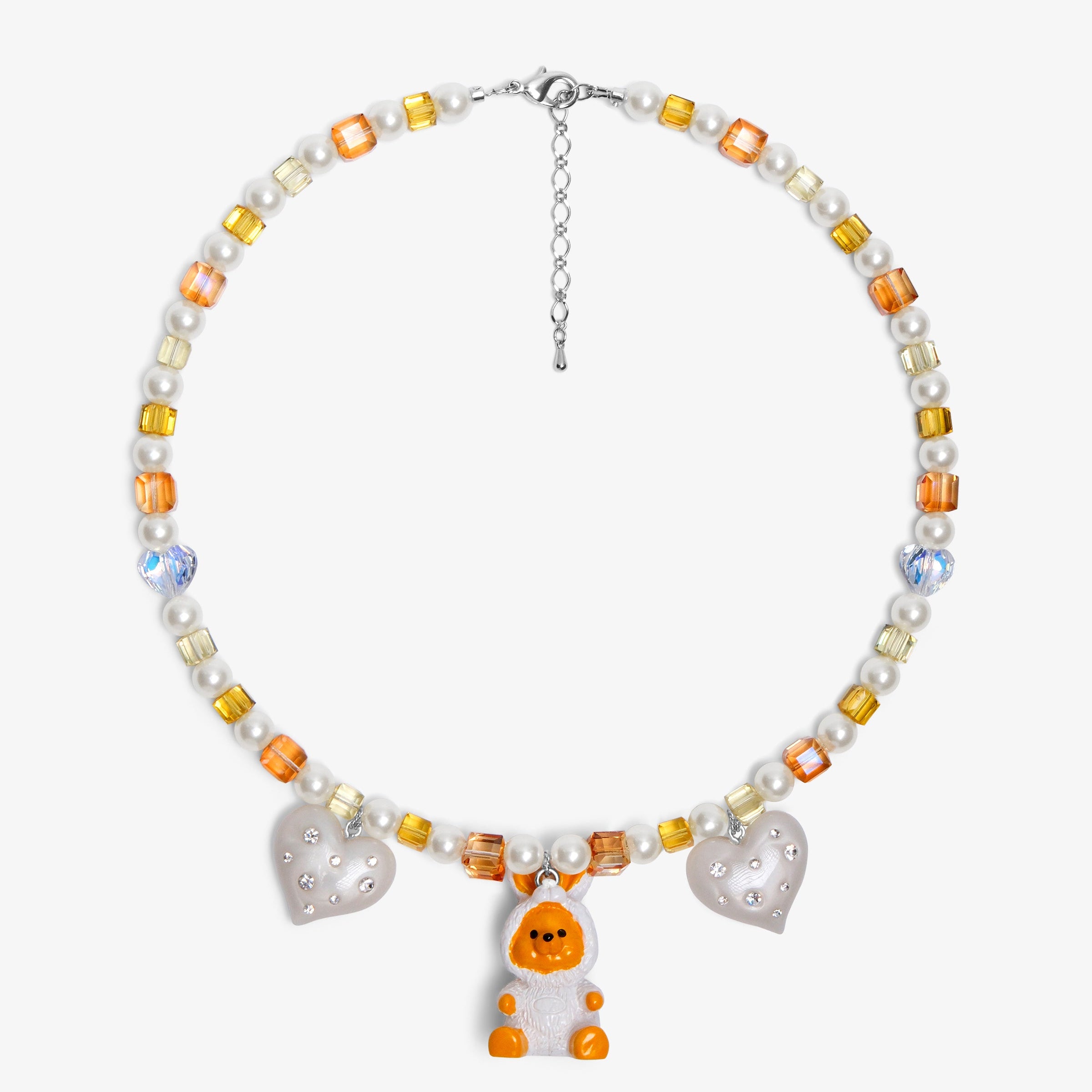Close-up of a handmade Swarovski crystal charm necklace with crystals, pearls and holiday-inspired collectible charm details