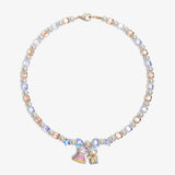 Close-up of a handmade Swarovski crystal charm necklace with crystals, pearls and princess-inspired collectible charm details
