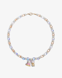 Close-up of a handmade Swarovski crystal charm necklace with crystals, pearls and princess-inspired collectible charm details