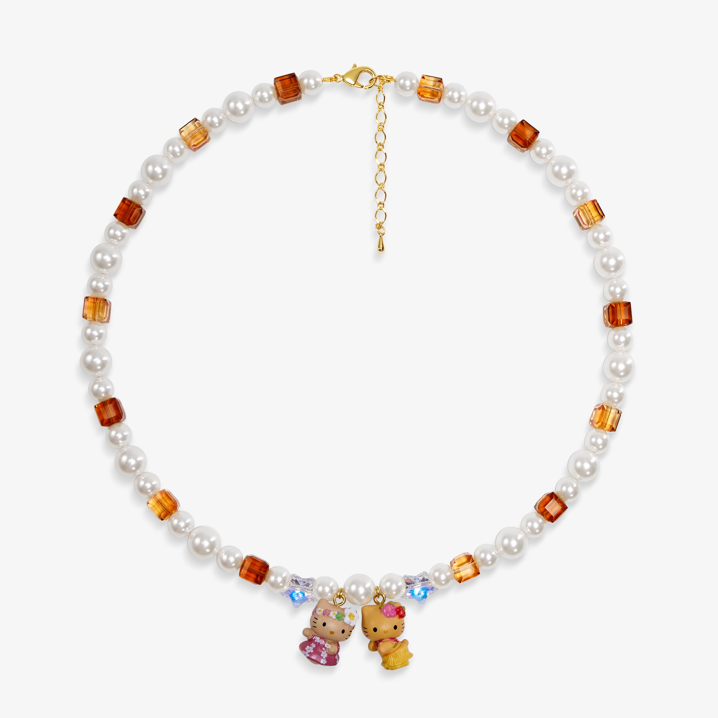 Close-up of a handmade Swarovski crystal charm necklace with crystals, pearls and surf-inspired collectible charm details