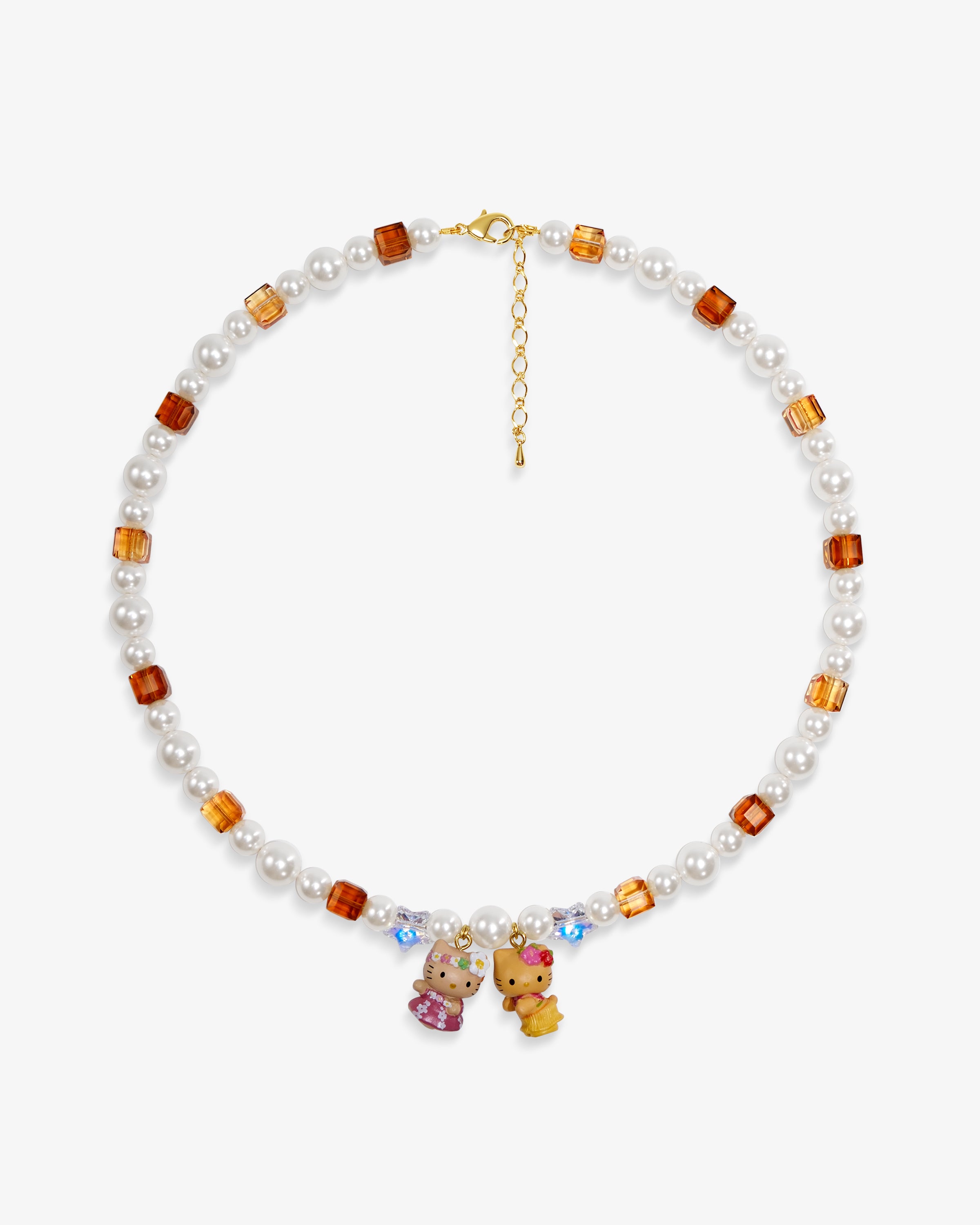 Close-up of a handmade Swarovski crystal charm necklace with crystals, pearls and surf-inspired collectible charm details