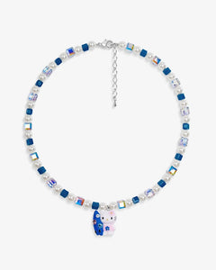 Close-up of a handmade Swarovski crystal charm necklace with crystals, pearls and surf-inspired collectible charm details