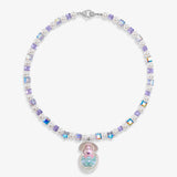 Close-up of a handmade Swarovski crystal charm necklace with crystals, pearls and surf-inspired collectible charm details