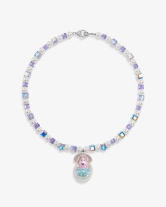 Close-up of a handmade Swarovski crystal charm necklace with crystals, pearls and surf-inspired collectible charm details