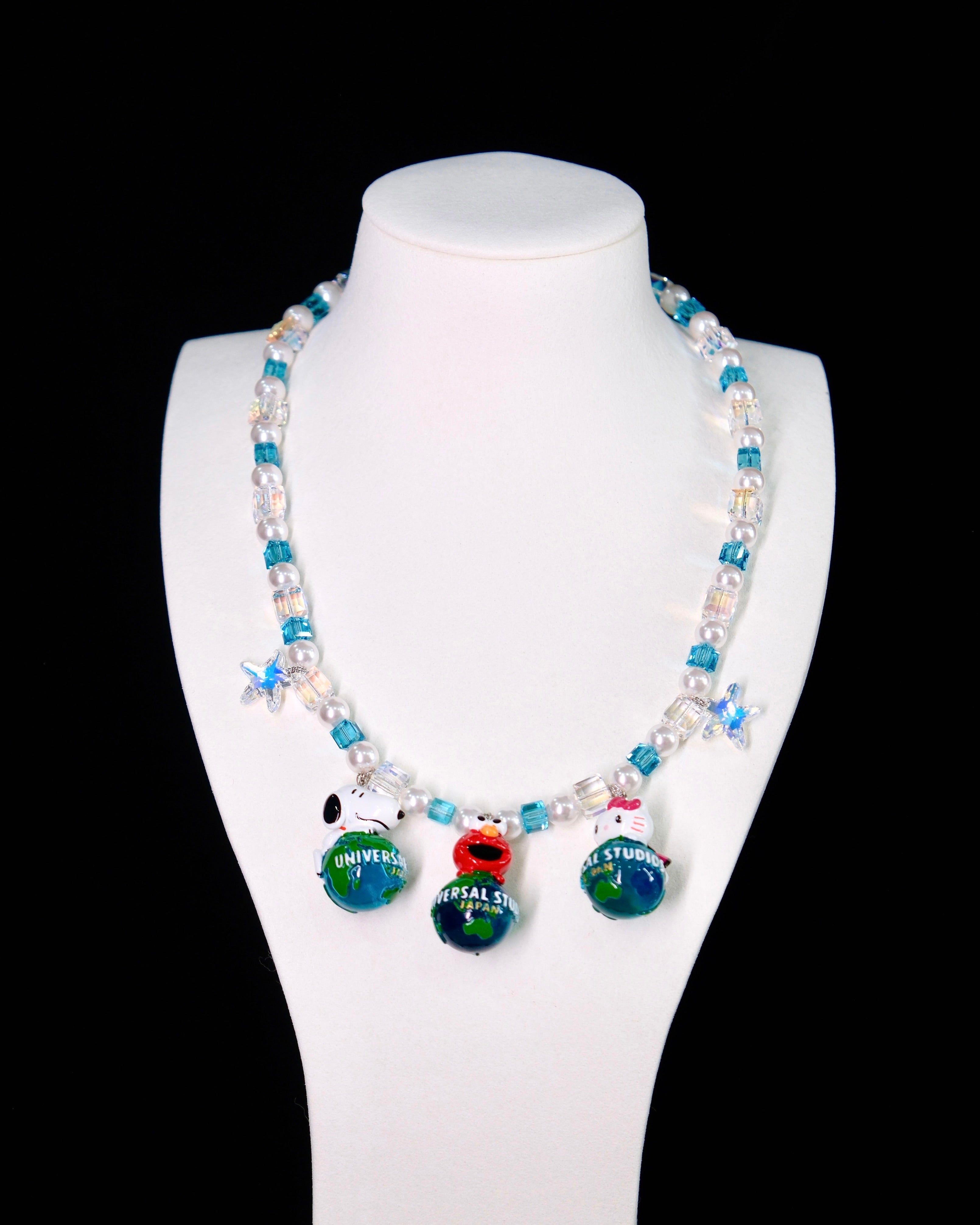 Product photo of Global Adventure Charm Necklace by Shinora Studio.
