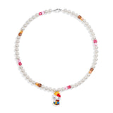 Close-up of a handmade Swarovski crystal charm necklace with crystals, pearls and western-inspired collectible charm details