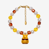 Honey Pot Bear Charm Bracelet with yellow and amber faceted beads, cream pearl-style beads and a bear in a HUNNY pot charm.