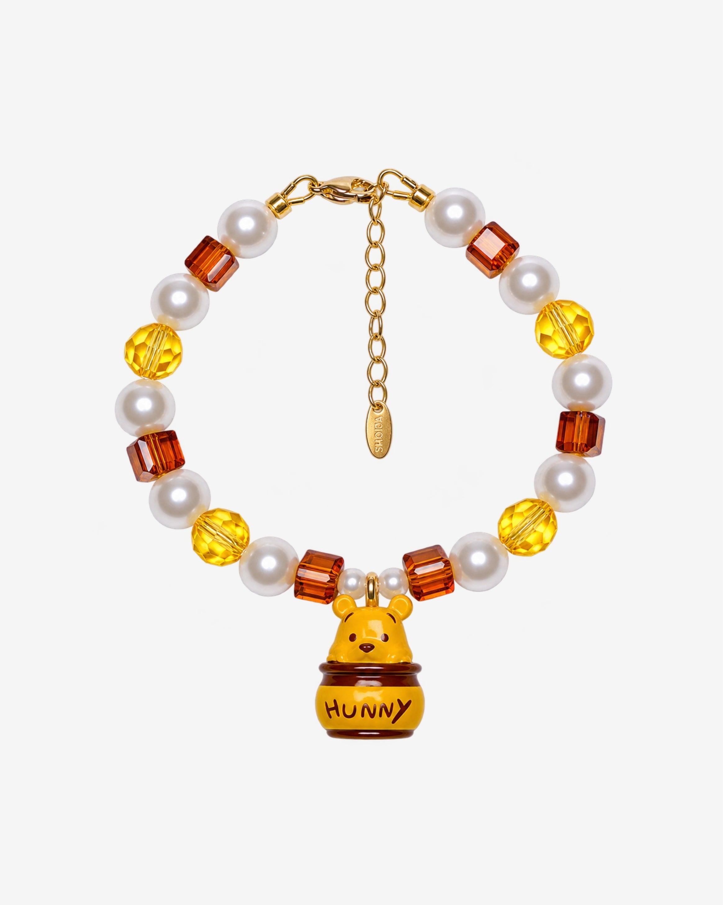 Honey Pot Bear Charm Bracelet with yellow and amber faceted beads, cream pearl-style beads and a bear in a HUNNY pot charm.