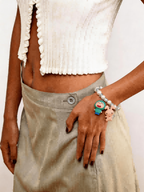 Model wearing handmade blue crystal charm bracelet with Swarovski beads and dual vintage charms