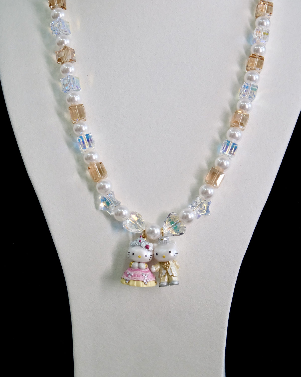 Swarovski crystal beads and pearls close-up on handmade charm necklace by ShinoraStudio