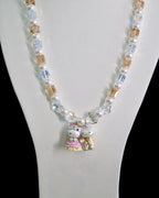 Swarovski crystal beads and pearls close-up on handmade charm necklace by ShinoraStudio