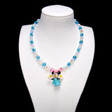 Aqua crystal cubes and pale iridescent rounds lead to pink crystal accents and a Minnie Mouse charm wearing a blue dress and pink bow, with yellow stars in her hands.