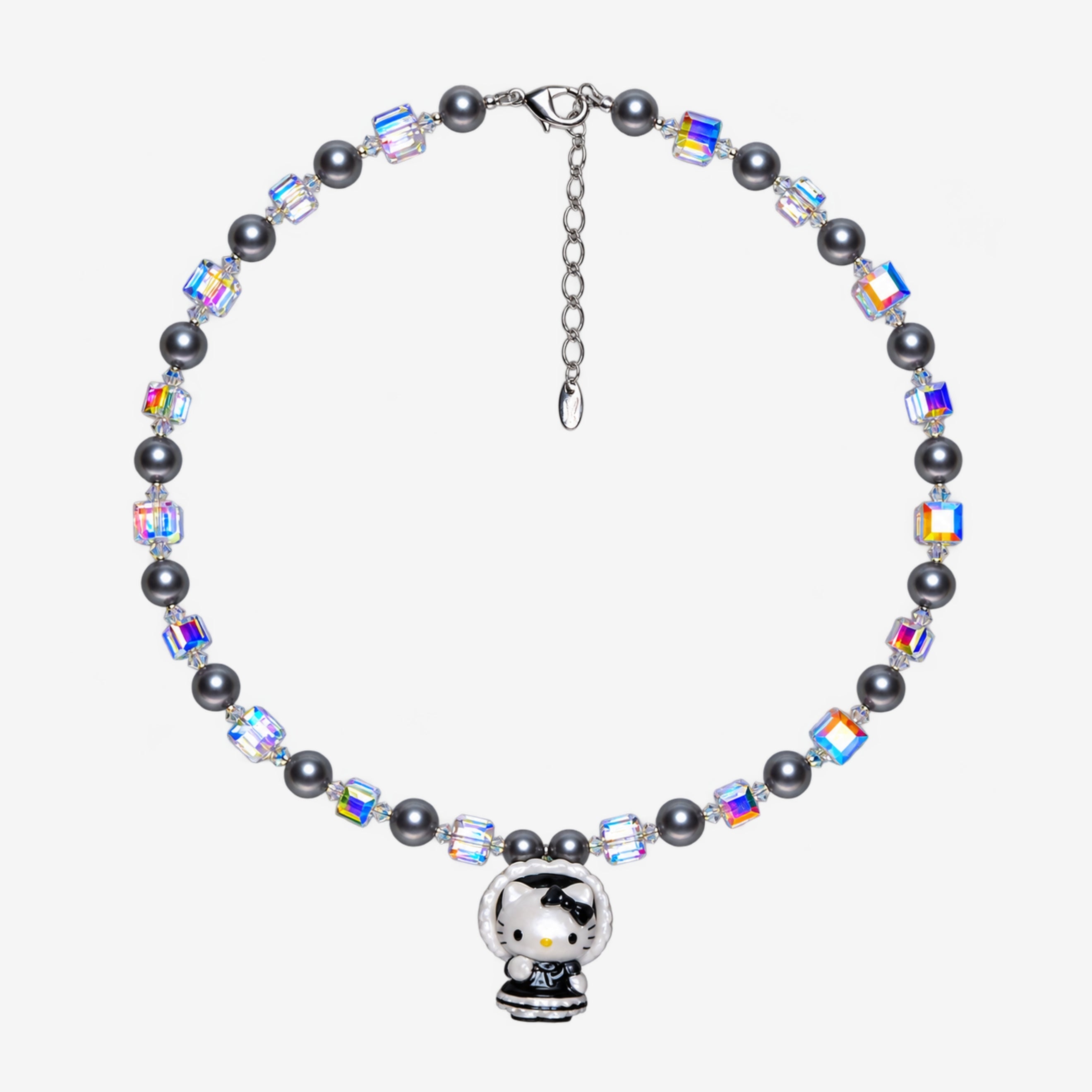 Necklace with dark gray Swarovski crystal pearls, iridescent crystal cubes and a cat charm in a black bonnet outfit with white trim.
