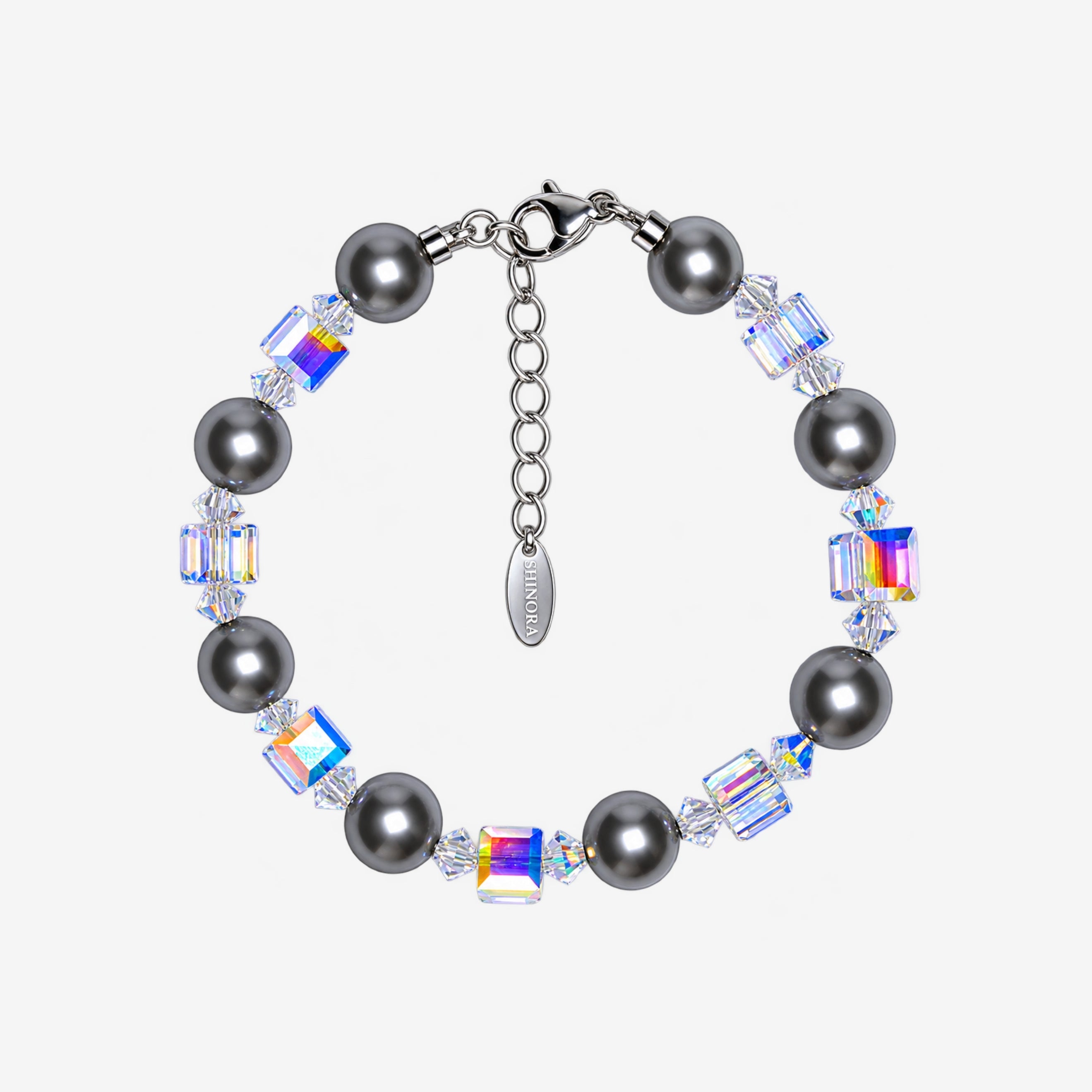 Bracelet with dark gray Swarovski crystal pearls, alternating iridescent crystal cubes, clear spacers and a silver-tone clasp.