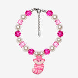 Pink Grin Cat Charm Bracelet with pink faceted round and cube beads, cream pearl-style beads and a smiling striped cat charm.
