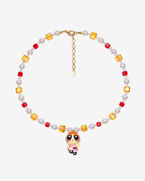 Necklace with red and amber Swarovski crystals, white crystal pearls and an orange-haired girl charm wearing a red bow and pink dress.