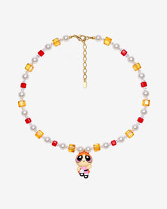 Necklace with red and amber Swarovski crystals, white crystal pearls and an orange-haired girl charm wearing a red bow and pink dress.