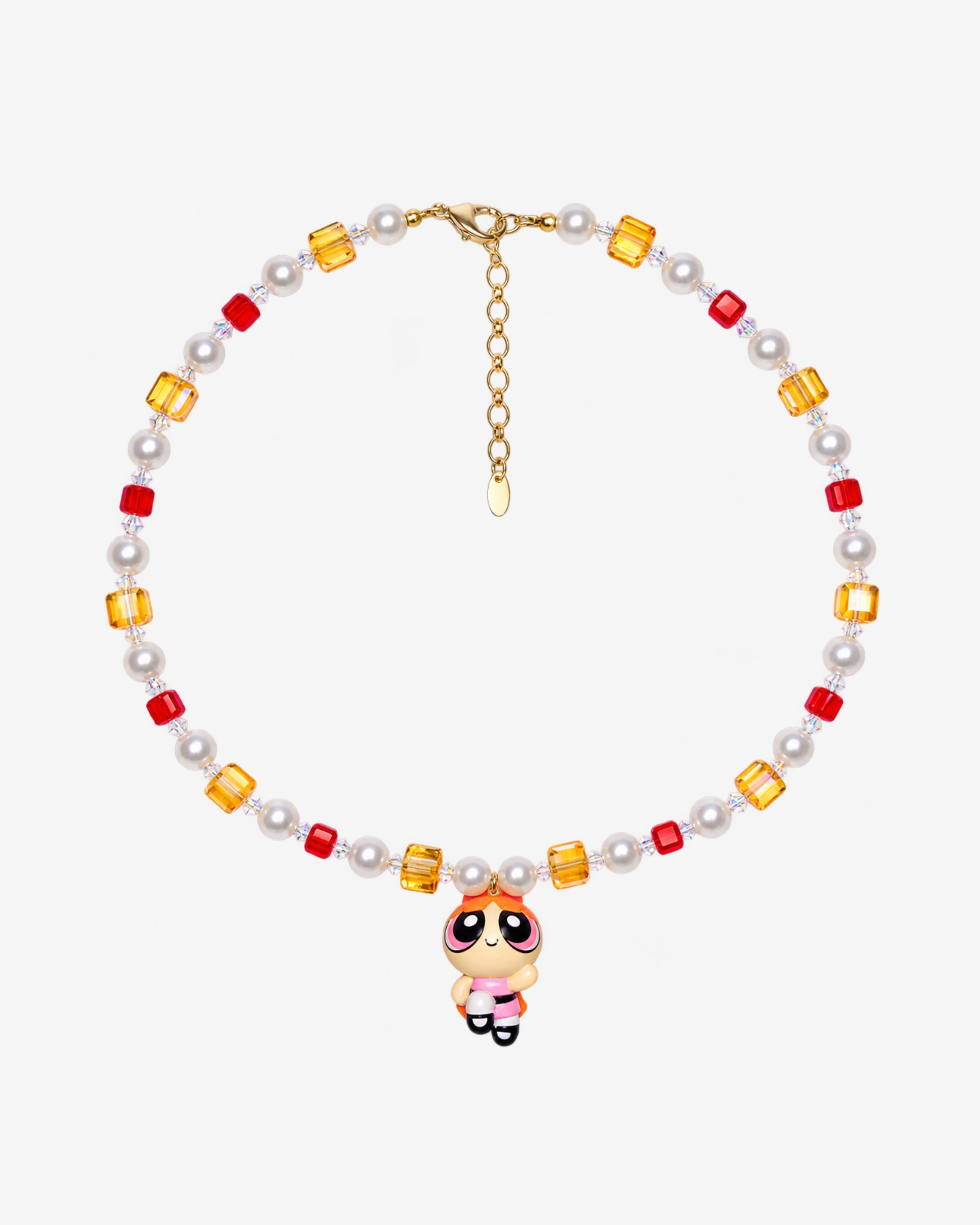Necklace with red and amber Swarovski crystals, white crystal pearls and an orange-haired girl charm wearing a red bow and pink dress.