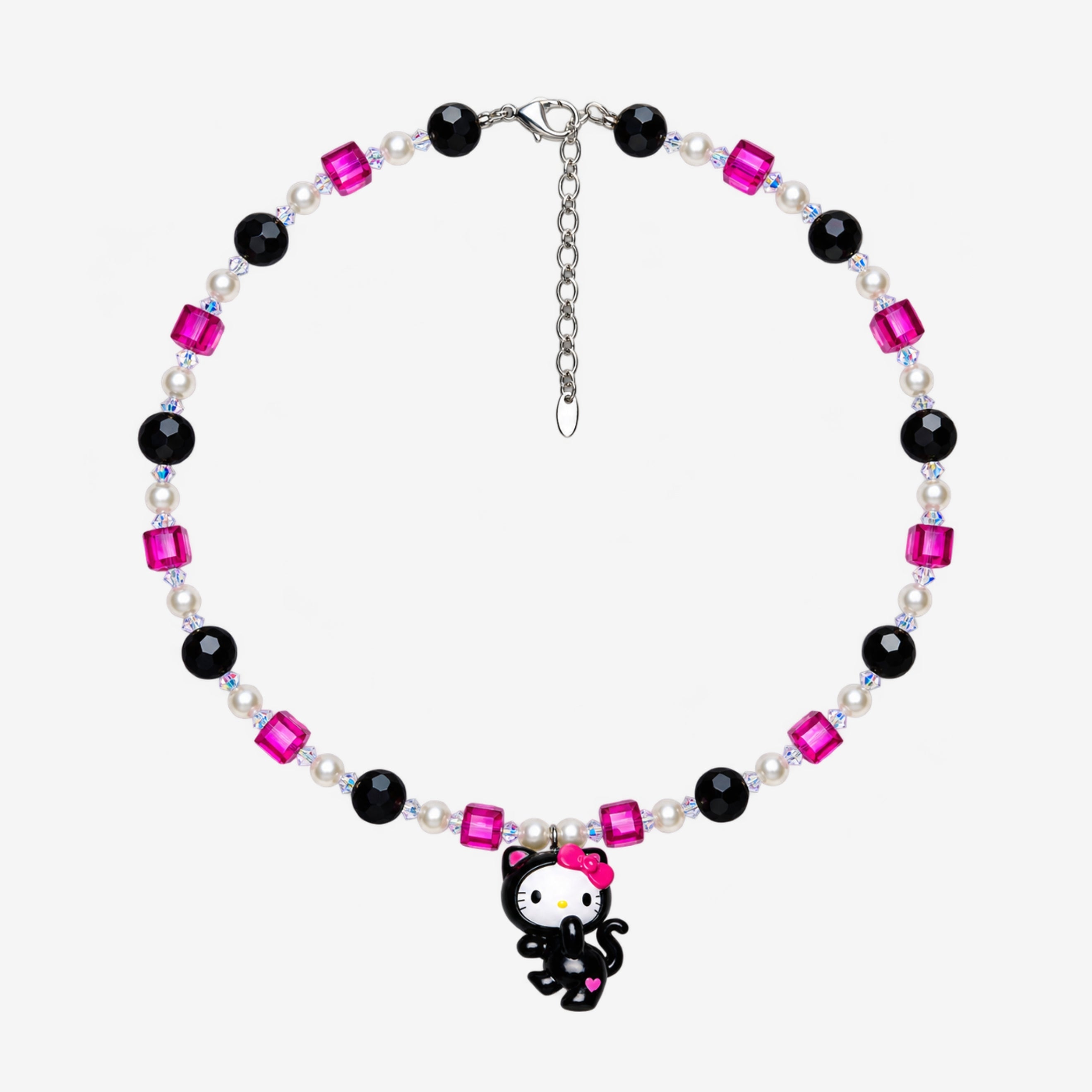 Necklace with fuchsia and black Swarovski crystals, white crystal pearls and a white-faced character charm in a black cat costume with a pink bow.
