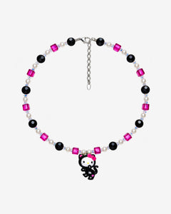 Necklace with fuchsia and black Swarovski crystals, white crystal pearls and a white-faced character charm in a black cat costume with a pink bow.