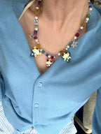 Model wearing Y2K coquette charm necklace with vintage Powerpuff Girls pendants