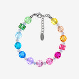 Bracelet with rainbow Swarovski crystal rounds, green and pink cubes, clear spacers and a silver-tone clasp.