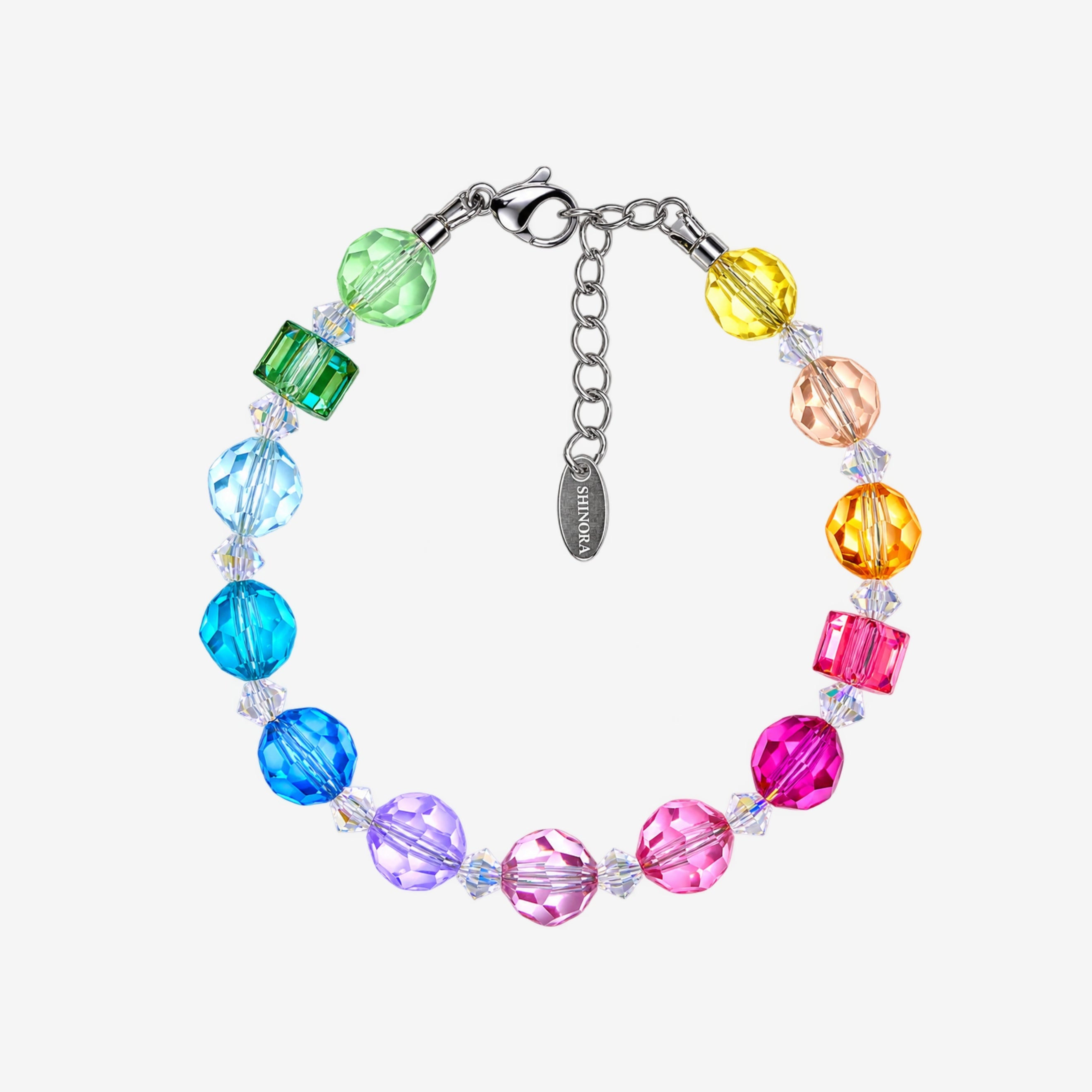 Bracelet with rainbow Swarovski crystal rounds, green and pink cubes, clear spacers and a silver-tone clasp.