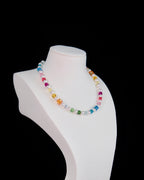 Close-up of rainbow Swarovski crystal cube beads and pearls on handmade multicolor necklace