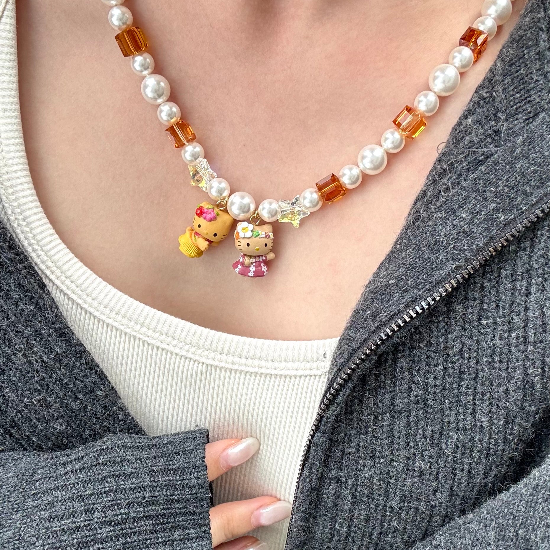 Gift-ready ShinoraStudio packaging for a handmade Swarovski crystal charm necklace with surf-inspired collectible charm details