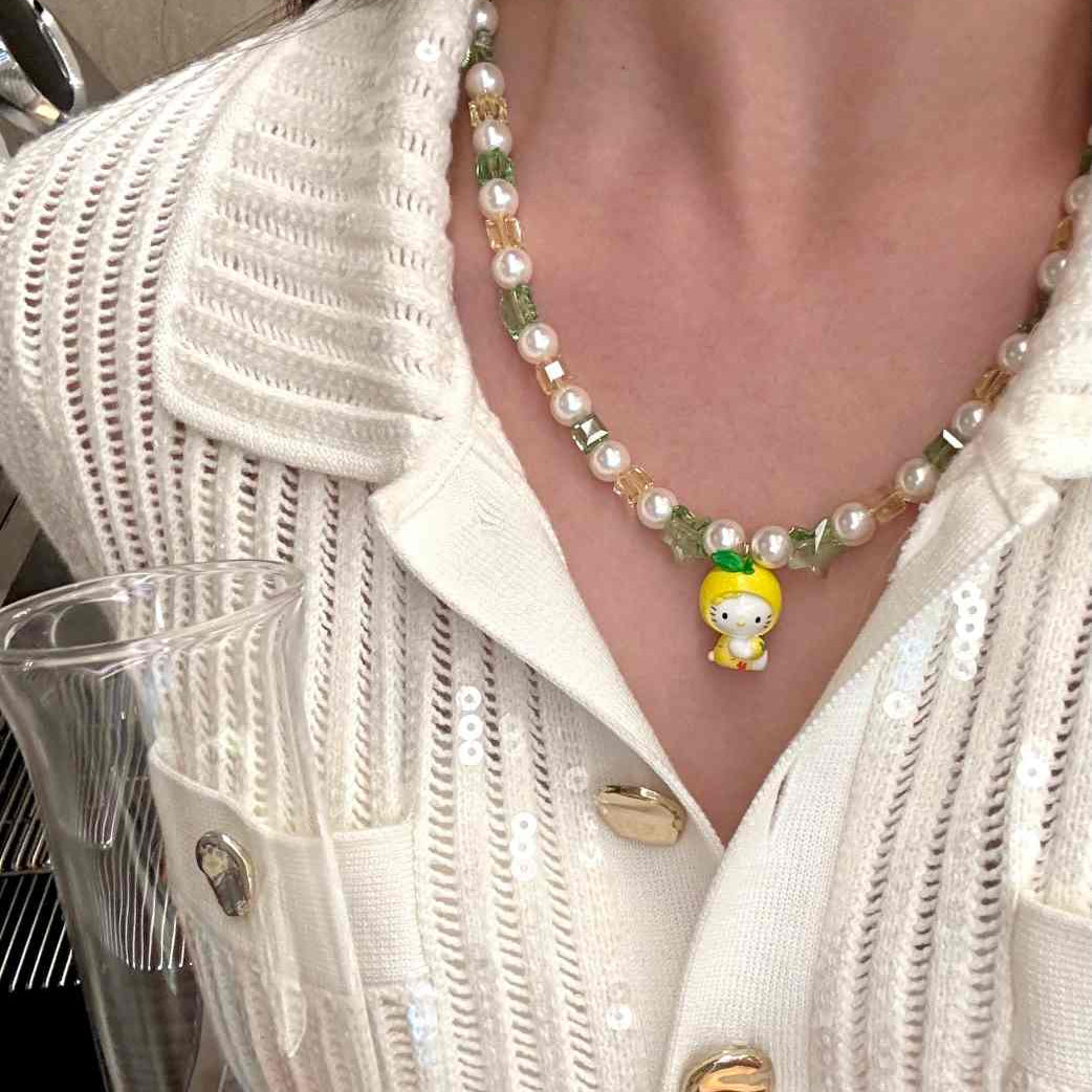 Gift-ready ShinoraStudio packaging for a handmade Swarovski crystal charm necklace with garden-inspired collectible charm details