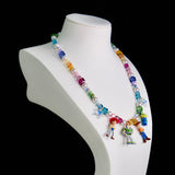 Gift-ready ShinoraStudio packaging for a handmade rainbow Swarovski crystal charm necklace with rainbow-inspired collectible charm details