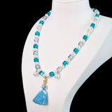 Gift-ready ShinoraStudio packaging for a handmade midnight Swarovski crystal charm necklace with princess-inspired collectible charm details
