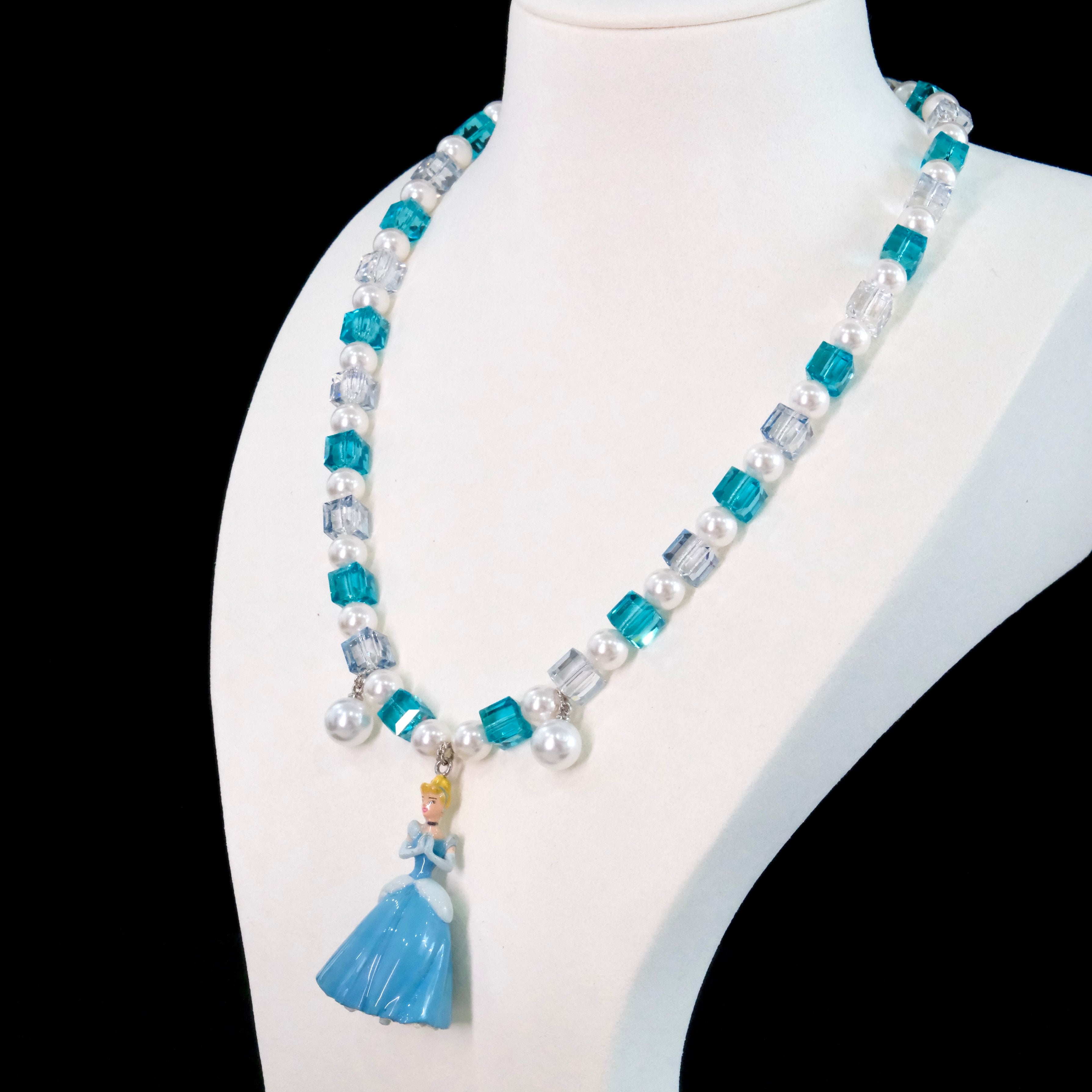 Gift-ready ShinoraStudio packaging for a handmade midnight Swarovski crystal charm necklace with princess-inspired collectible charm details