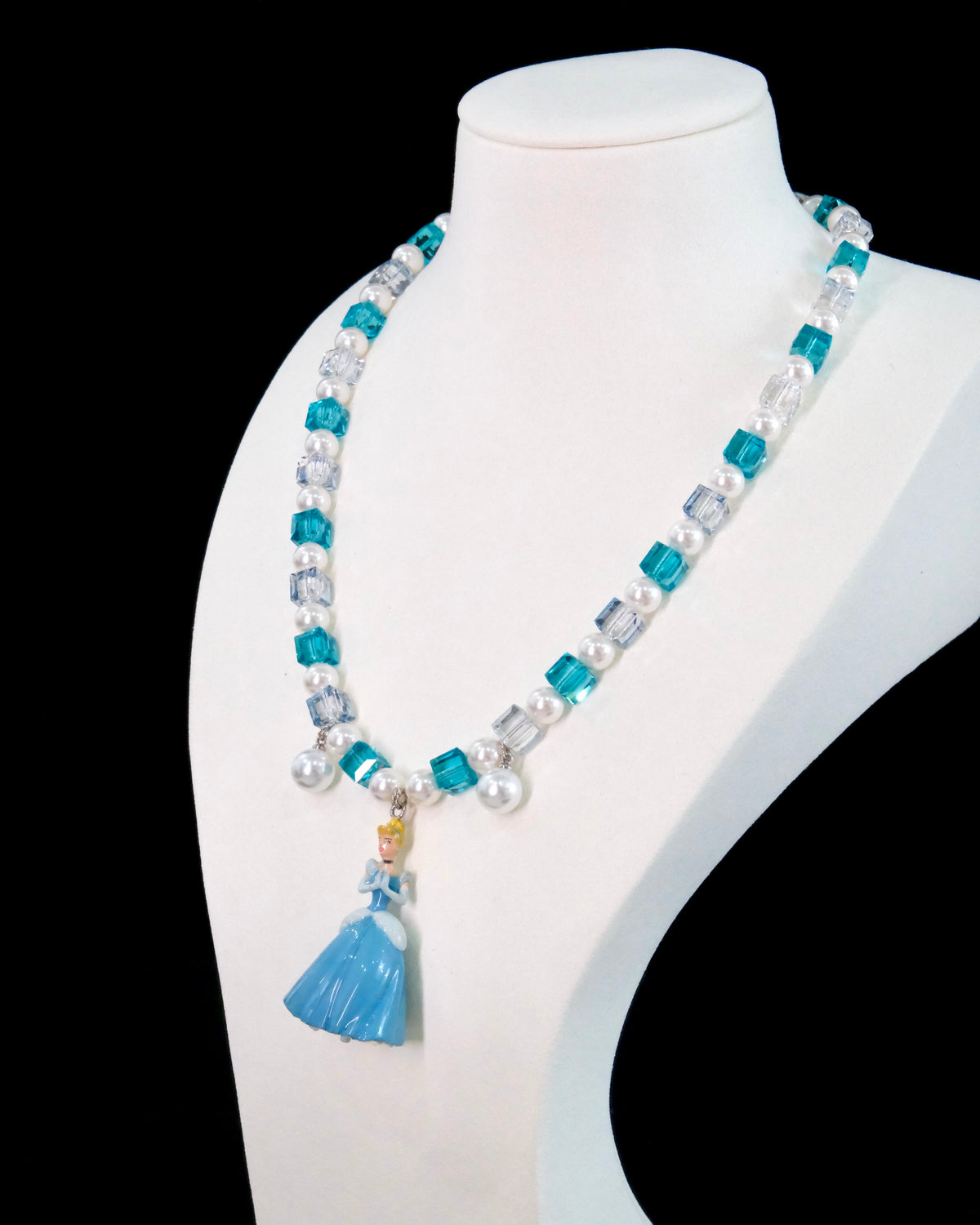 Gift-ready ShinoraStudio packaging for a handmade midnight Swarovski crystal charm necklace with princess-inspired collectible charm details