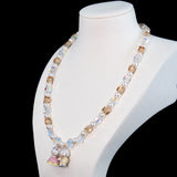 Gift-ready ShinoraStudio packaging for a handmade Swarovski crystal charm necklace with princess-inspired collectible charm details
