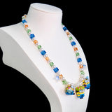 Gift-ready ShinoraStudio packaging for a handmade Swarovski crystal charm necklace with garden-inspired collectible charm details