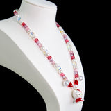 Gift-ready ShinoraStudio packaging for a handmade Swarovski crystal charm necklace with sweetheart-inspired collectible charm details